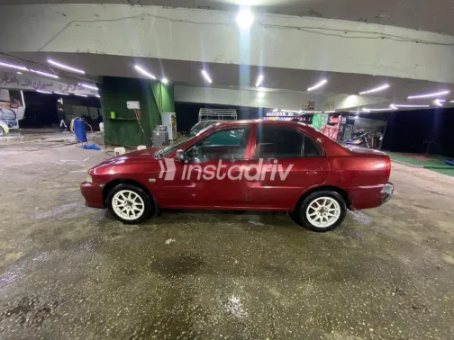 ميتسوبيشي ميراج 1999 أحمر مستعملة للبيع - 1