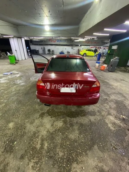ميتسوبيشي ميراج 1999 أحمر مستعملة للبيع - 2