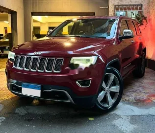جيب جراند شيروكي 2014 أحمر مستعملة للبيع