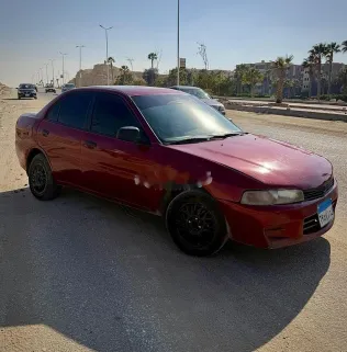 ميتسوبيشي لانسر كرستالة 1997 أحمر غامق مستعملة للبيع