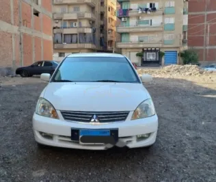 ميتسوبيشي لانسر بومة 2014 أبيض مستعملة للبيع