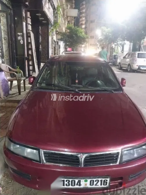 ميتسوبيشي لانسر 1996 أحمر مستعملة للبيع - 1