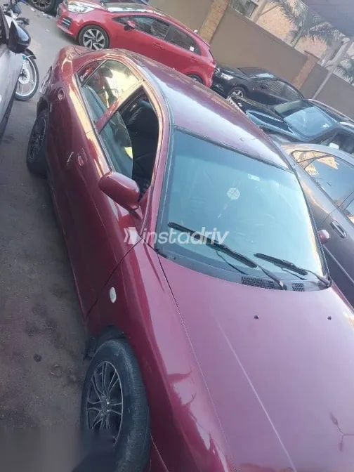 ميتسوبيشي لانسر 1996 أحمر مستعملة للبيع - 9