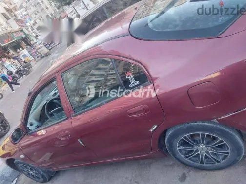 ميتسوبيشي لانسر 1996 أحمر مستعملة للبيع - 10