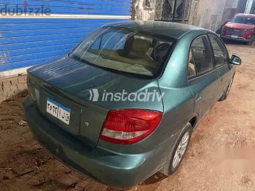 كيا ريو 2003 أخضر مستعملة للبيع - 7