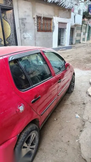 فولكس فاغن بولو 1995 أحمر مستعملة للبيع