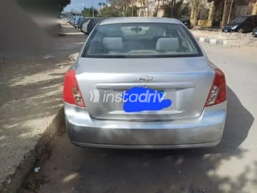 شيفروليه أوبترا 2010 فضي مستعملة للبيع - 1