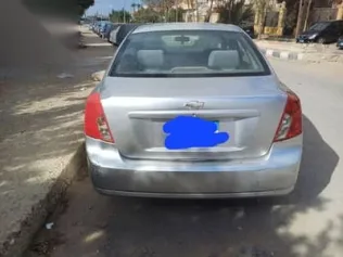 شيفروليه أوبترا 2010 فضي مستعملة للبيع