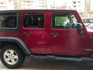 جيب رانجلر 2014 أحمر غامق مستعملة للبيع
