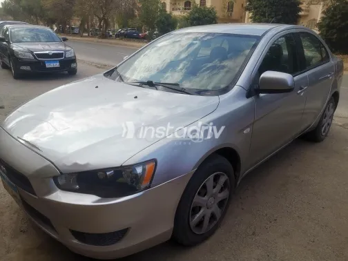 ميتسوبيشي لانسر اى اكس شارك 2014 ذهبي مستعملة للبيع - 1