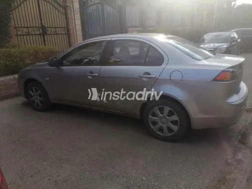 ميتسوبيشي لانسر اى اكس شارك 2014 ذهبي مستعملة للبيع - 3