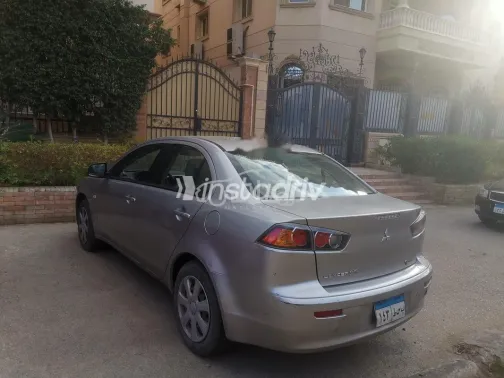 ميتسوبيشي لانسر اى اكس شارك 2014 ذهبي مستعملة للبيع - 4