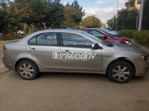 ميتسوبيشي لانسر اى اكس شارك 2014 ذهبي مستعملة للبيع - 5