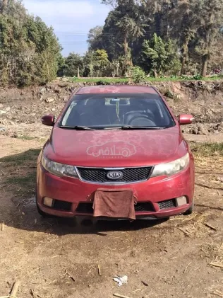 كيا سيراتو 2009 أحمر غامق مستعملة للبيع