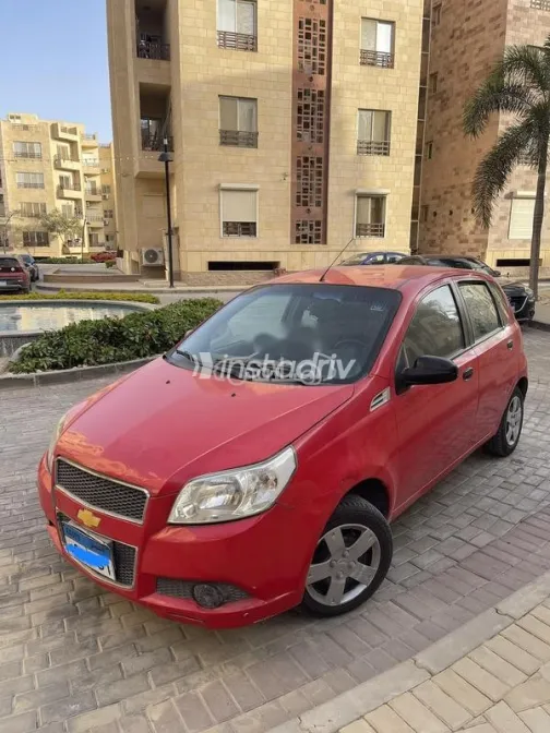 شيفروليه افيو 2009 أحمر مستعملة للبيع - 1
