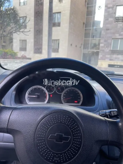 شيفروليه افيو 2009 أحمر مستعملة للبيع - 2