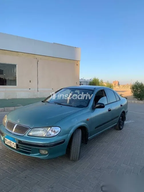 نيسان صنى 2002 أخضر مستعملة للبيع - 1