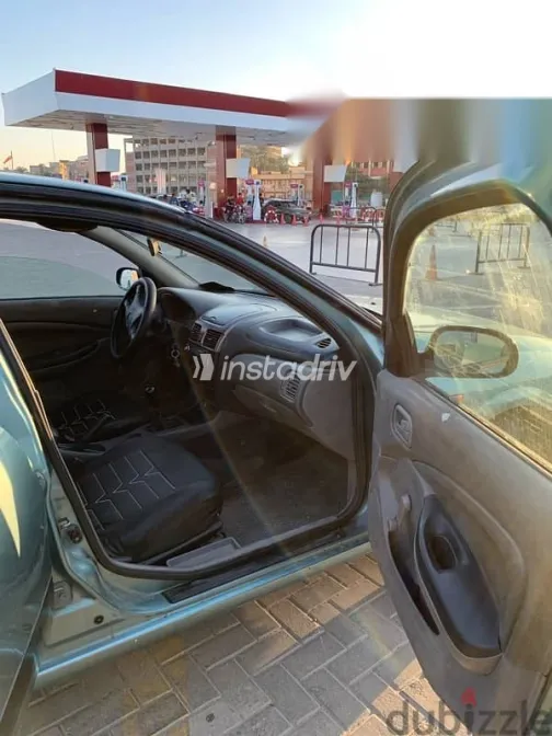 نيسان صنى 2002 أخضر مستعملة للبيع - 7