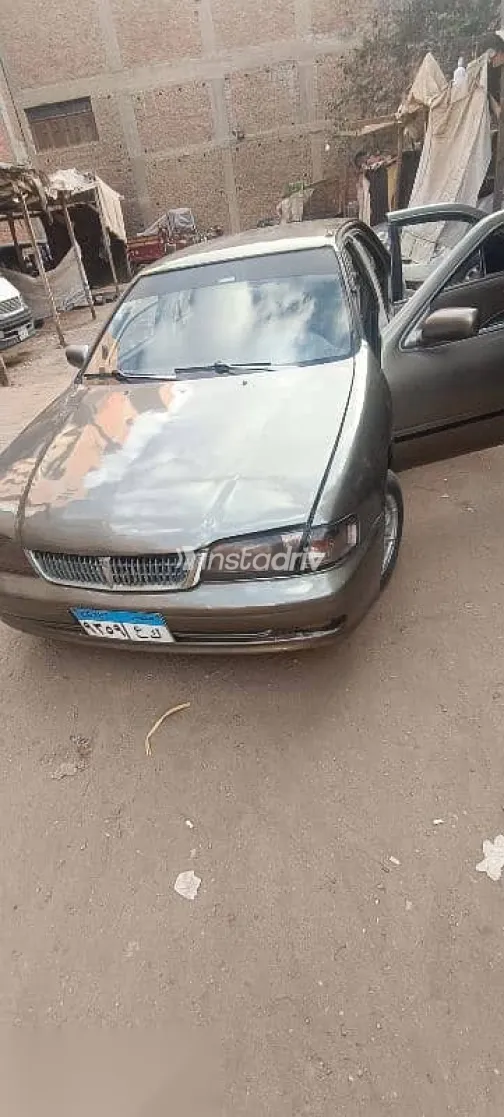 نيسان صنى 1999 ذهبي مستعملة للبيع - 3