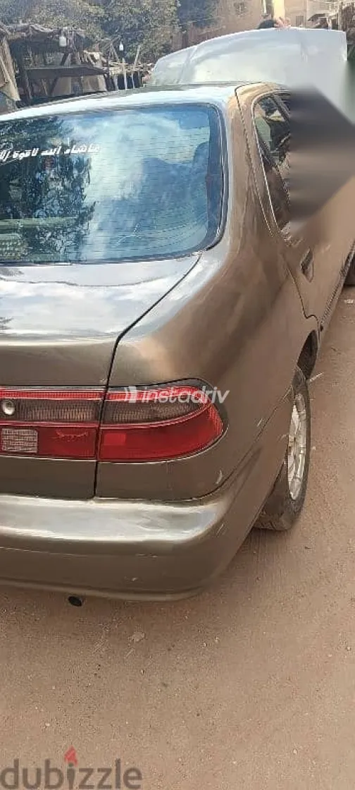 نيسان صنى 1999 ذهبي مستعملة للبيع - 4