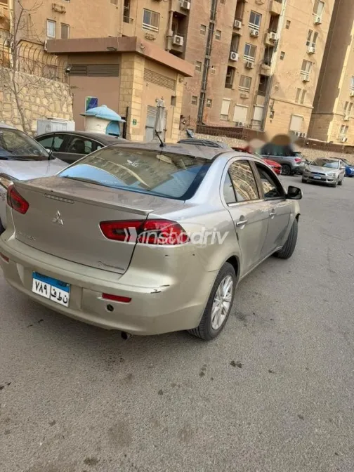 ميتسوبيشي لانسر اى اكس شارك 2014 فضي مستعملة للبيع - 3