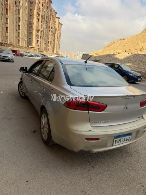 ميتسوبيشي لانسر اى اكس شارك 2014 فضي مستعملة للبيع - 4