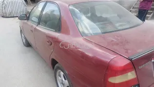 دايو نوبيرا 2 2001 أحمر غامق مستعملة للبيع