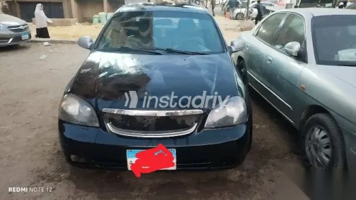 شيفروليه أوبترا 2010 أسود مستعملة للبيع - 1