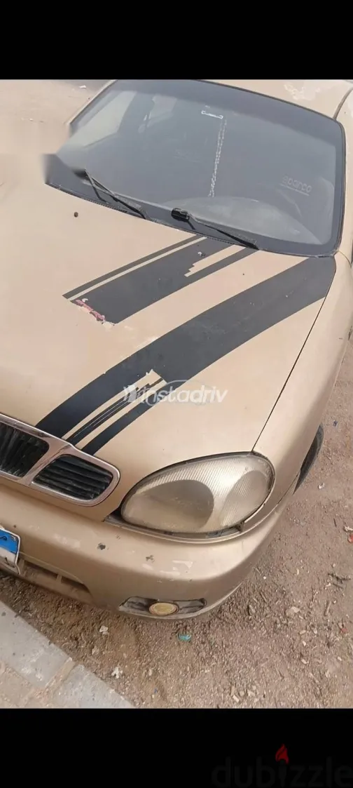 دايو لانوس 2005 ذهبي مستعملة للبيع - 1