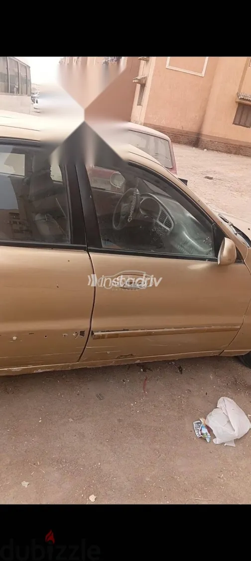 دايو لانوس 2005 ذهبي مستعملة للبيع - 4