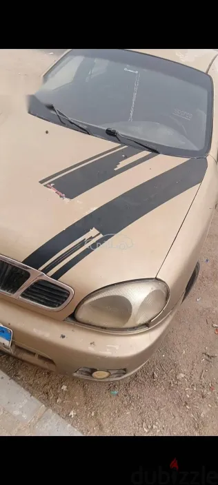 دايو لانوس 2005 ذهبي مستعملة للبيع