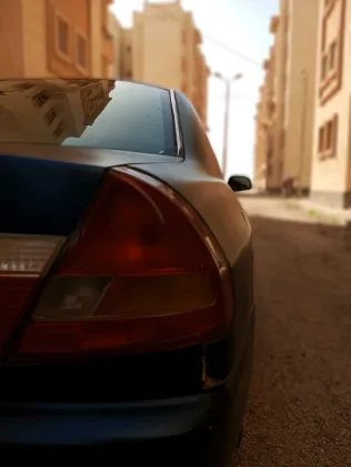 ميتسوبيشي لانسر 1998 أبيض مستعملة للبيع