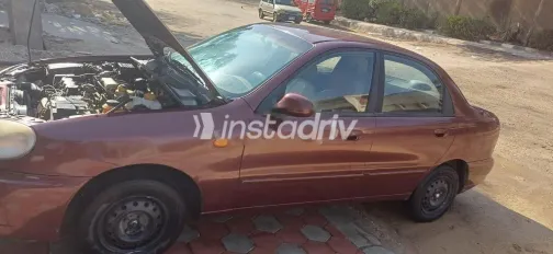 شيفروليه لانوس 2010 أحمر غامق مستعملة للبيع - 1