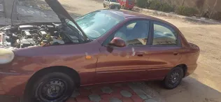 شيفروليه لانوس 2010 أحمر غامق مستعملة للبيع