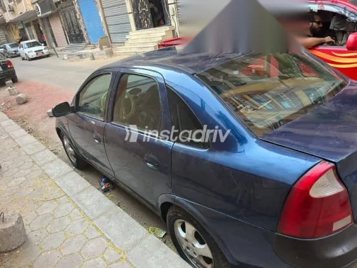 اوبل كورسا 2003 أزرق غامق مستعملة للبيع - 1
