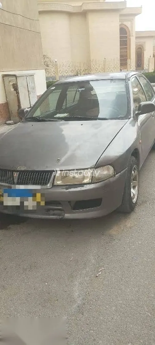 ميتسوبيشي لانسر 1999 رمادي مستعملة للبيع - 1