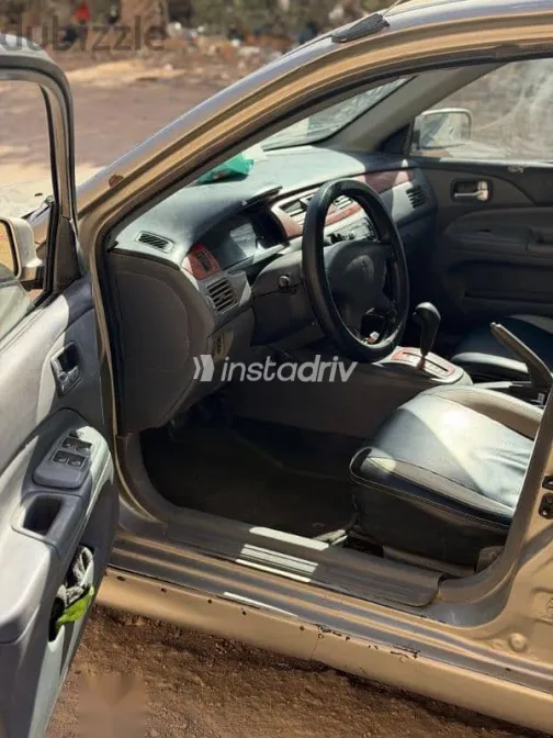 ميتسوبيشي لانسر 2003 فضي مستعملة للبيع - 3