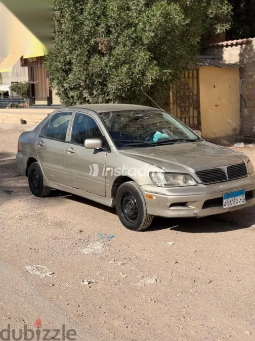 ميتسوبيشي لانسر 2003 فضي مستعملة للبيع - 5
