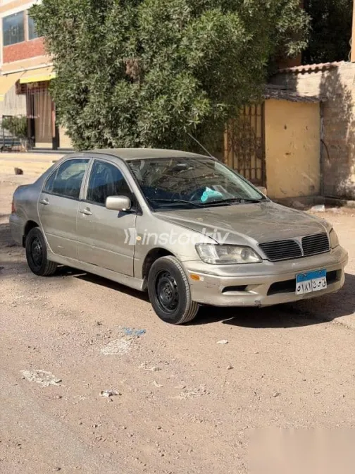 ميتسوبيشي لانسر 2003 فضي مستعملة للبيع - 7