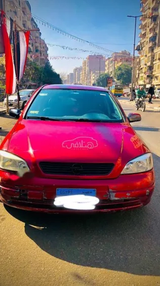 اوبل أسترا 2000 أحمر غامق مستعملة للبيع