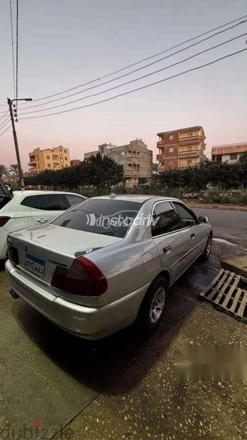 ميتسوبيشي لانسر 1999 فضي مستعملة للبيع - 2