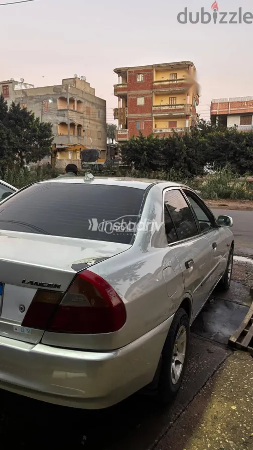 ميتسوبيشي لانسر 1999 فضي مستعملة للبيع - 3