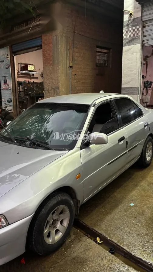 ميتسوبيشي لانسر 1999 فضي مستعملة للبيع - 6