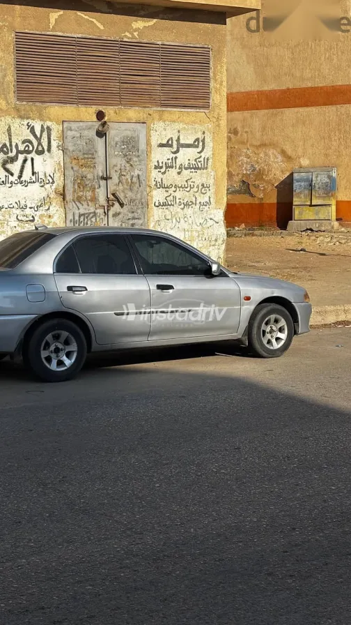 ميتسوبيشي لانسر 1999 فضي مستعملة للبيع - 7