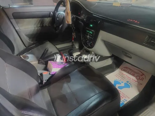 شيفروليه أوبترا 2014 أبيض مستعملة للبيع - 5