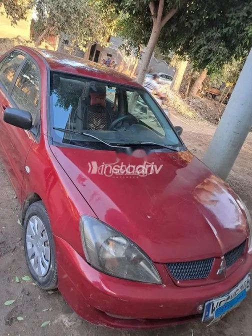 ميتسوبيشي لانسر بومة 2007 أحمر غامق مستعملة للبيع - 1