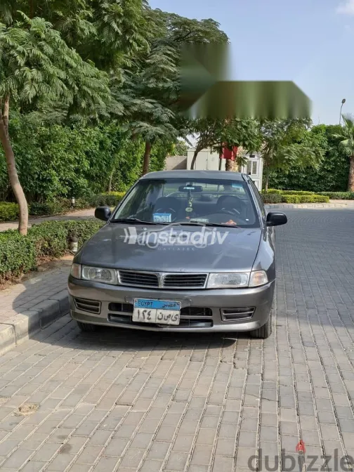 ميتسوبيشي لانسر 1997 فضي مستعملة للبيع - 1