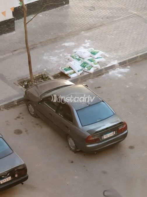 ميتسوبيشي لانسر 1997 فضي مستعملة للبيع - 7