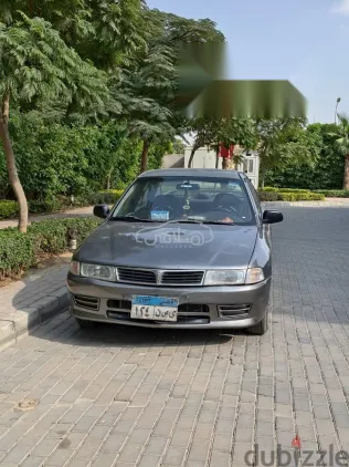 ميتسوبيشي لانسر 1997 فضي مستعملة للبيع