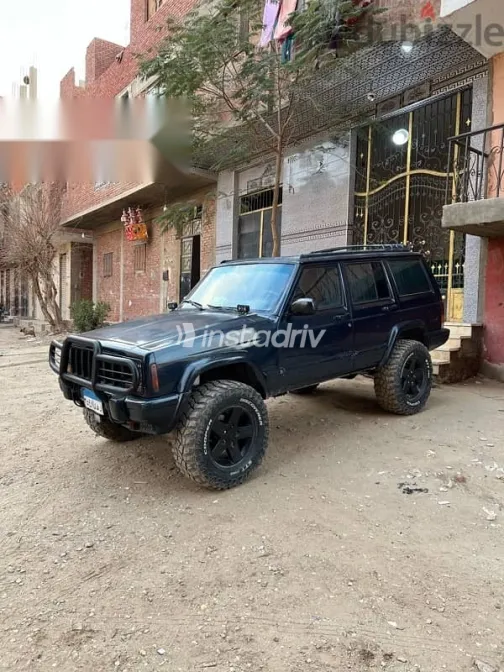 جيب شيروكي 1999 أزرق غامق مستعملة للبيع - 3